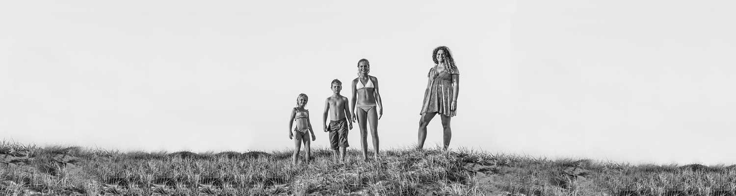 Happy family on sand dune